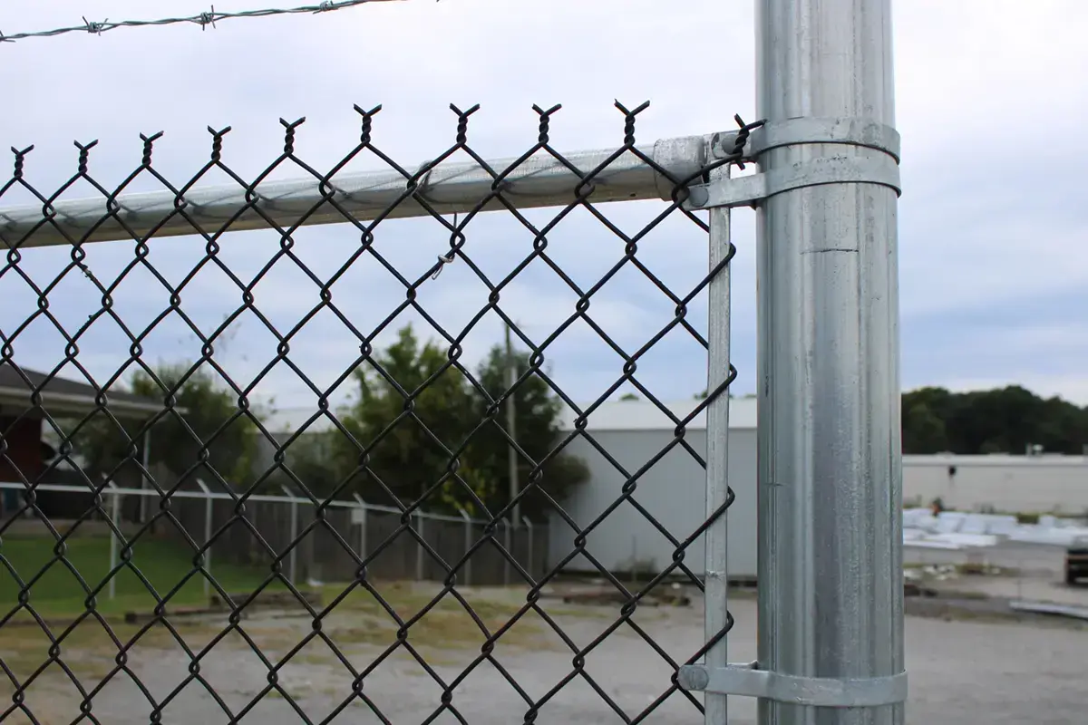 Close up view of the security chain link fence installation in charleston sc