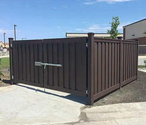 Commercial composite dumpster enclosure with steel lock gate in charleston sc