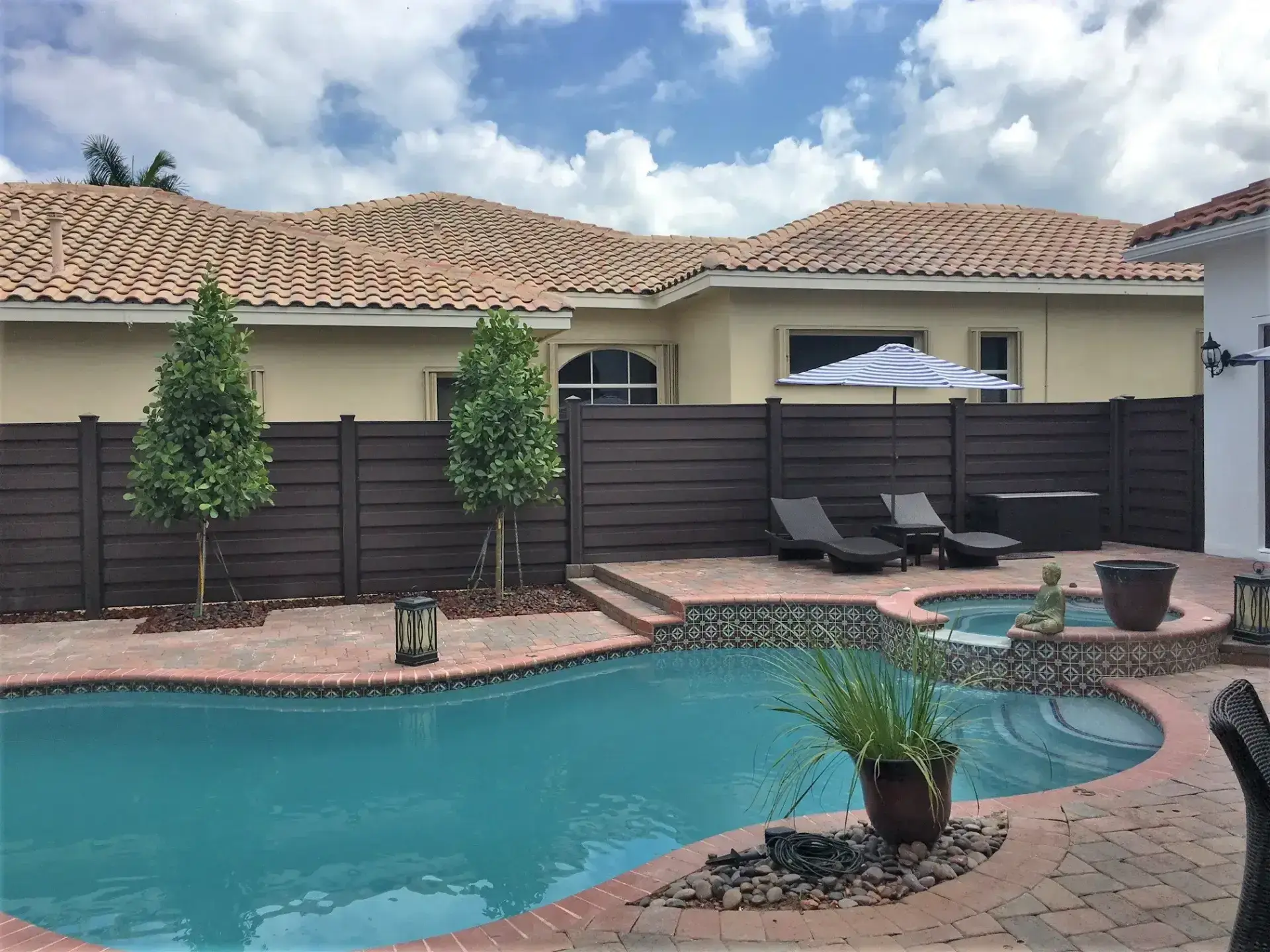 Horizons pool and hot tub with outdoor beach lounge and pool fence installation in charleston sc