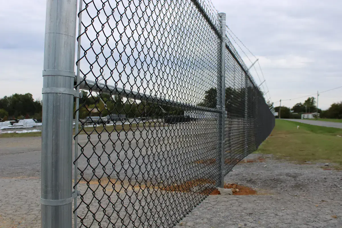 Security chain link fence installation on a cloudy area in charleston sc