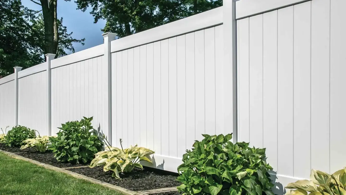 White vinyl security wall fence installation and beside it in charleston sc