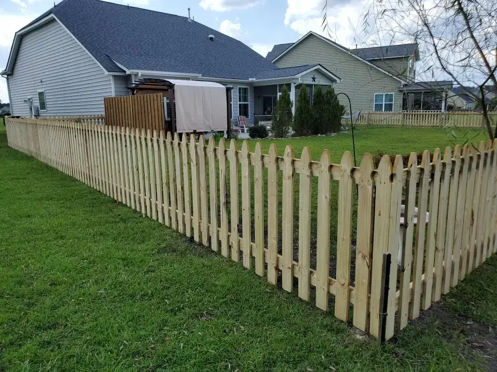Wooden picket fence and privacy wall screen with pergola on the house in charleston sc